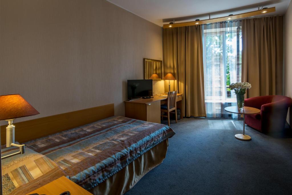 TV a/nebo společenská místnost v ubytování Perkuno Namai Park Hotel