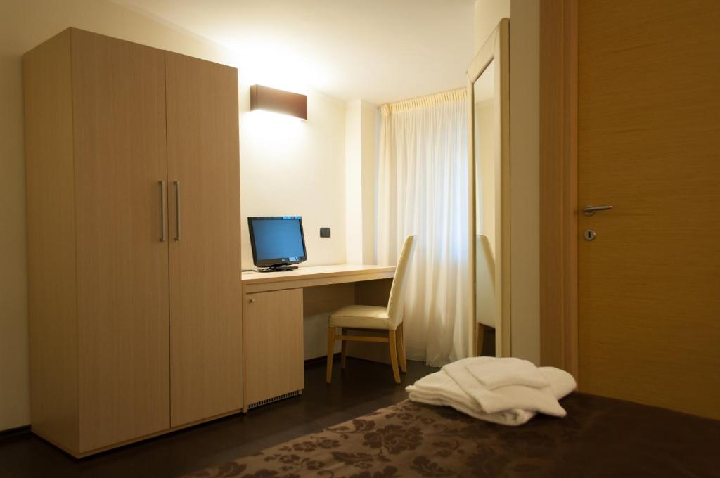 Postel nebo postele na pokoji v ubytování Hotel Sogni D'Oro Airport