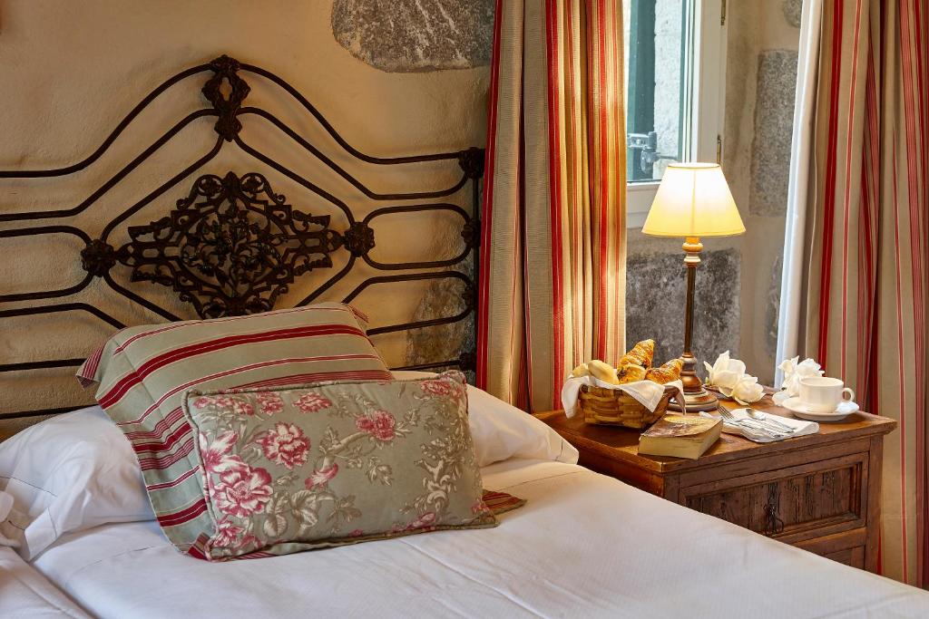 Postel nebo postele na pokoji v ubytování Hotel Zubieta