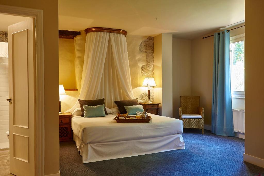 Postel nebo postele na pokoji v ubytování Hotel Zubieta