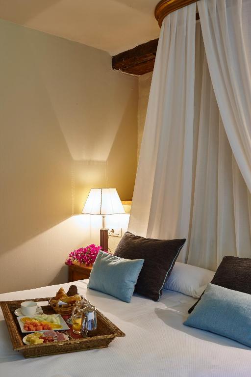 Postel nebo postele na pokoji v ubytování Hotel Zubieta