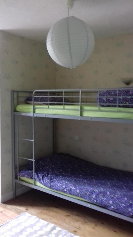 Postel nebo postele na pokoji v ubytování L'as Gourmand