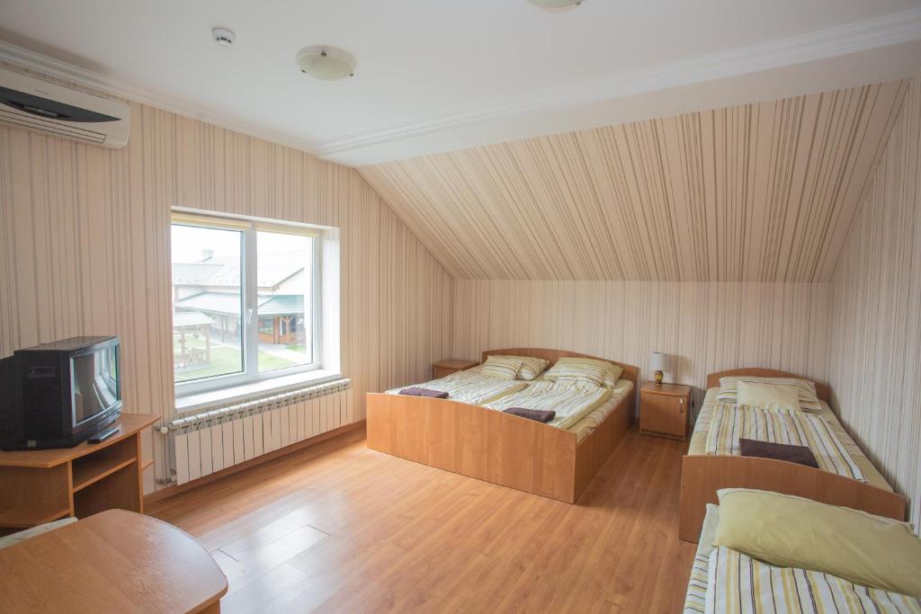 Postel nebo postele na pokoji v ubytování Praktik Hotel & Restaurant