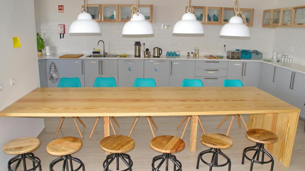 Kuchyň nebo kuchyňský kout v ubytování Topcity Hostel & Suites