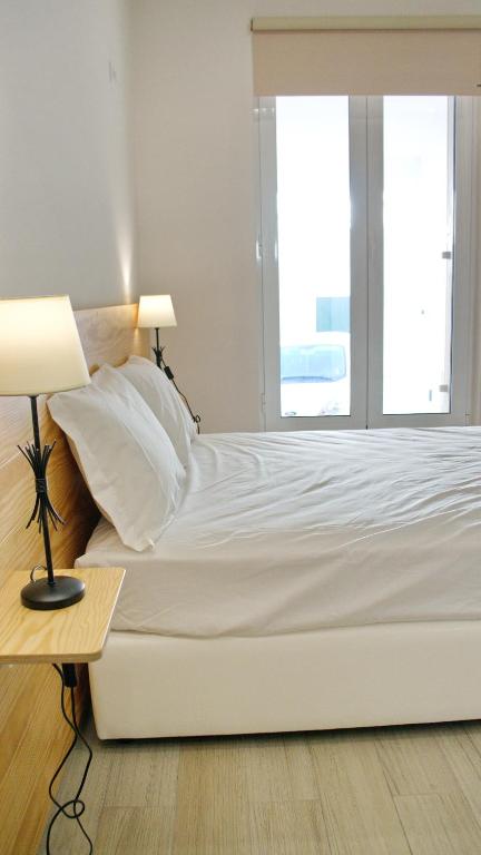 Postel nebo postele na pokoji v ubytování Topcity Hostel & Suites