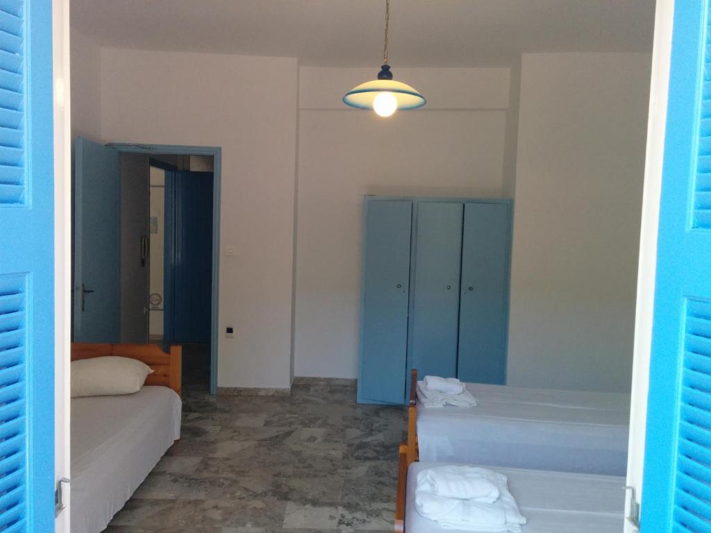 Postel nebo postele na pokoji v ubytování Panos Studios