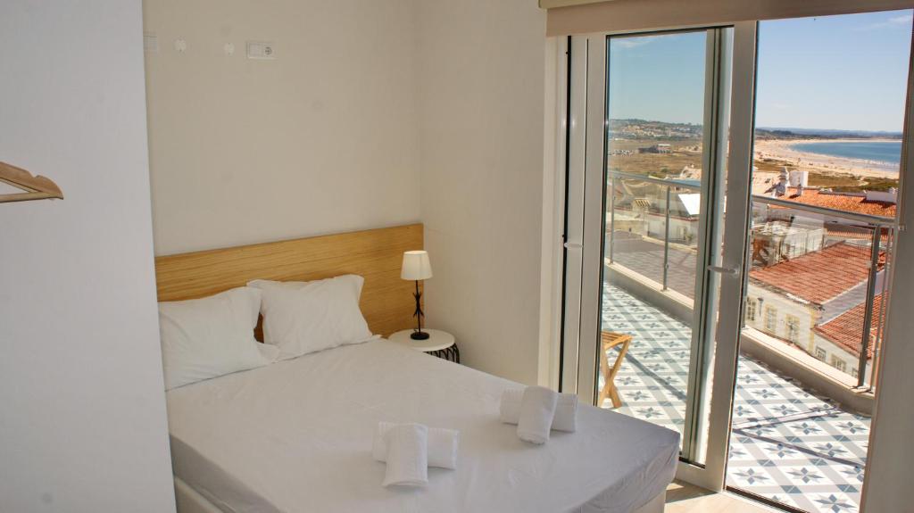Postel nebo postele na pokoji v ubytování Topcity Hostel & Suites
