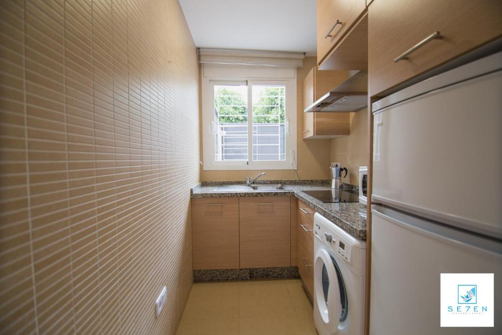 Kuchyňa alebo kuchynka v ubytovaní Apartamentos Seven Village