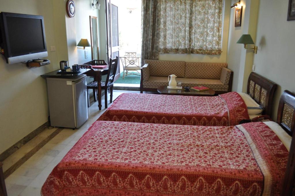 Letto o letti in una camera di Hotel Arya Niwas