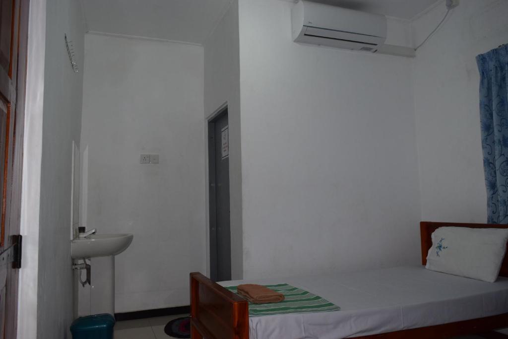Postel nebo postele na pokoji v ubytování Nest Inn
