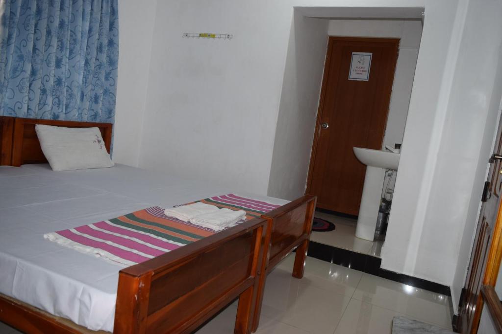 Postel nebo postele na pokoji v ubytování Nest Inn