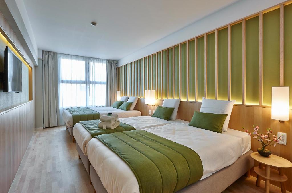 Postel nebo postele na pokoji v ubytování Yadoya Hotel