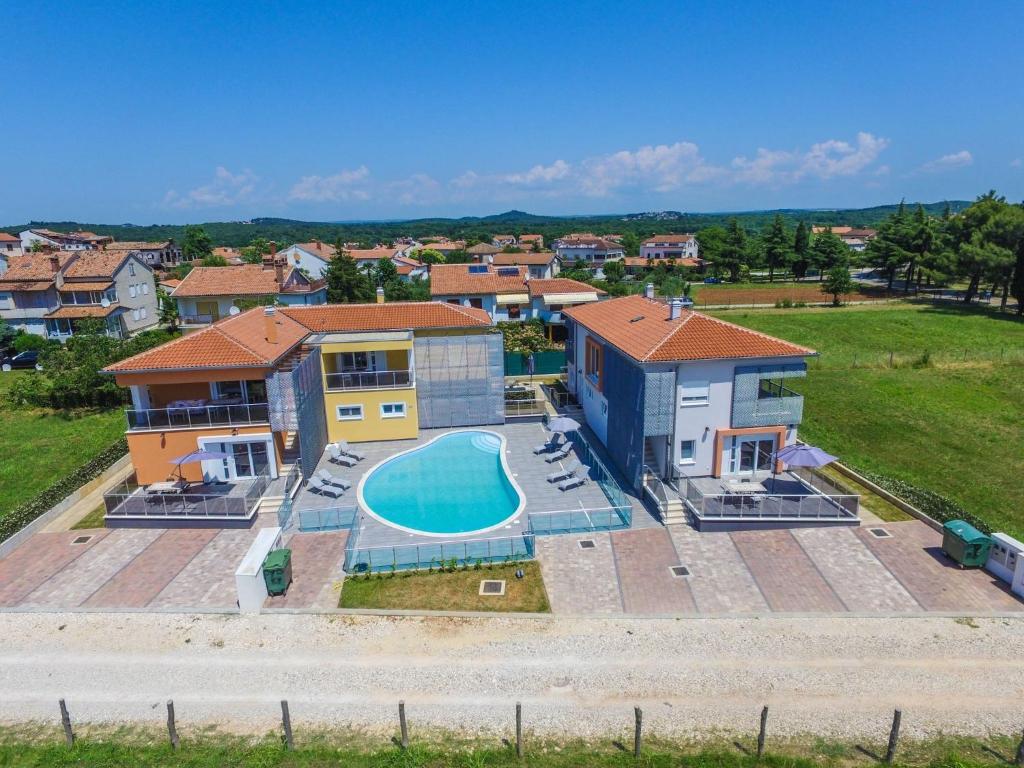 an aerial view of a house with a swimming pool at Funtana Two-Bedroom Apartment 1 in Funtana