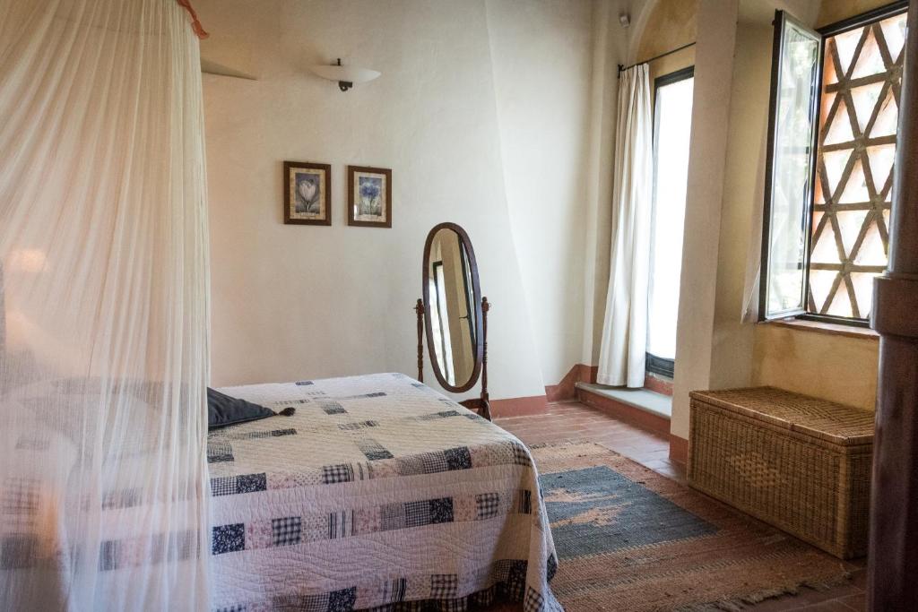 Postel nebo postele na pokoji v ubytování Il Borghetto Tuscan Holidays