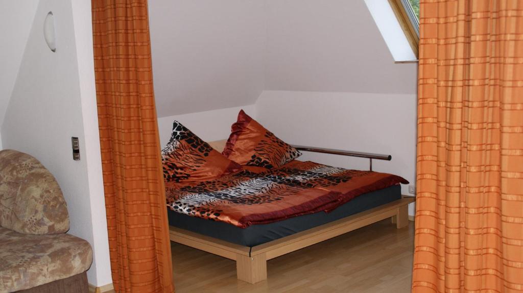 a mirror reflection of a bed in a room at Ferienhaus Moni in Elmenthal