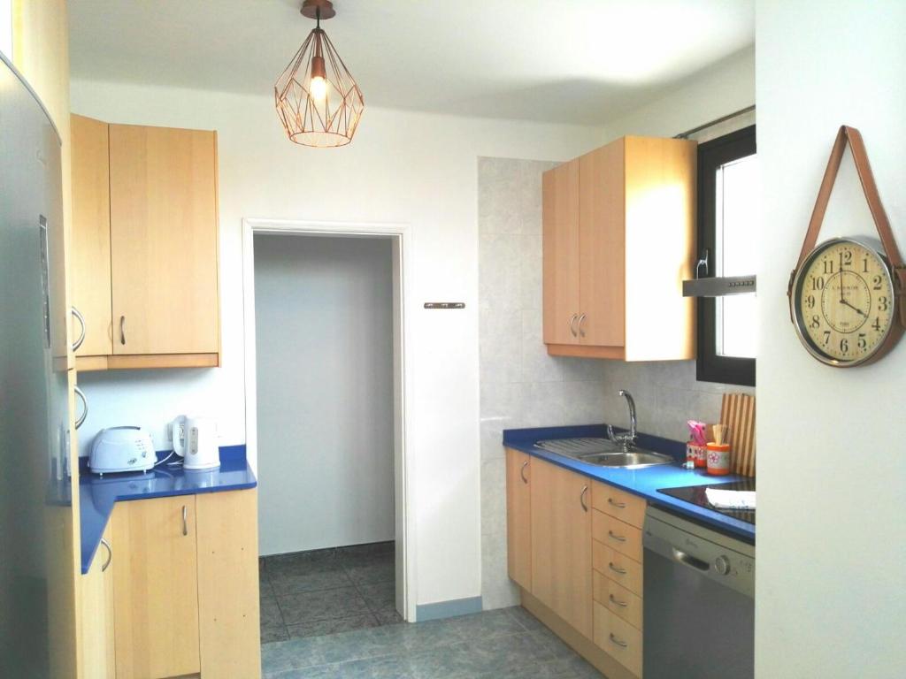 A kitchen or kitchenette at Central Seaview Apartment Puerto del Carmen
