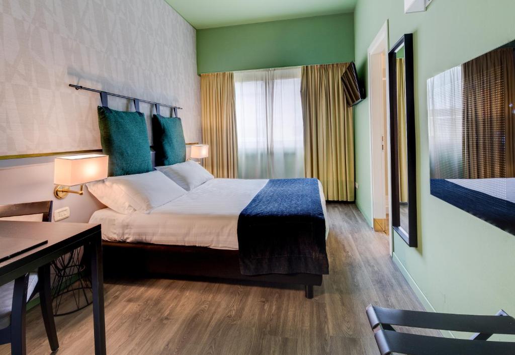 Postel nebo postele na pokoji v ubytování Best Western Plus CHC Florence