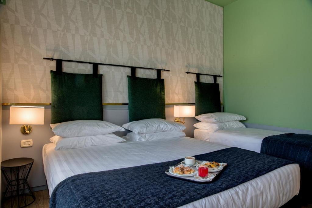 Postel nebo postele na pokoji v ubytování Best Western Plus CHC Florence