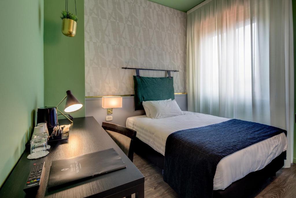 Postel nebo postele na pokoji v ubytování Best Western Plus CHC Florence