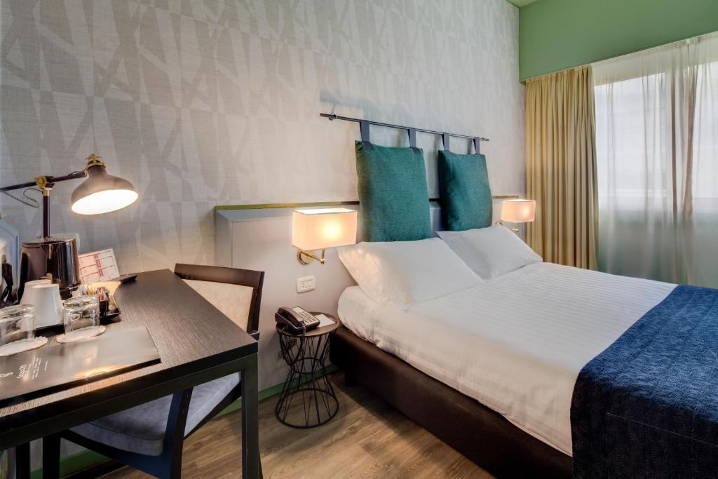 Postel nebo postele na pokoji v ubytování Best Western Plus CHC Florence