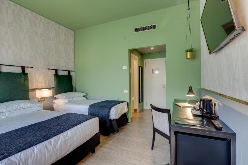 Postel nebo postele na pokoji v ubytování Best Western Plus CHC Florence