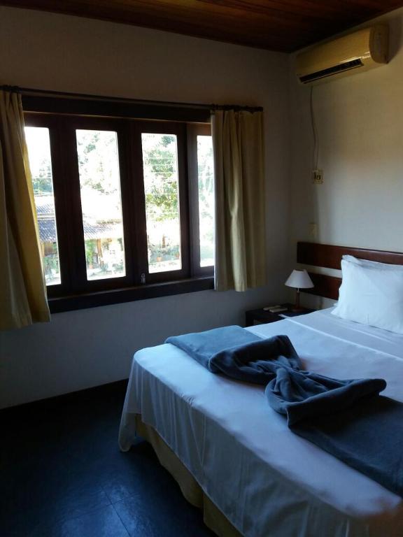 Postel nebo postele na pokoji v ubytování Taipabas Hotel