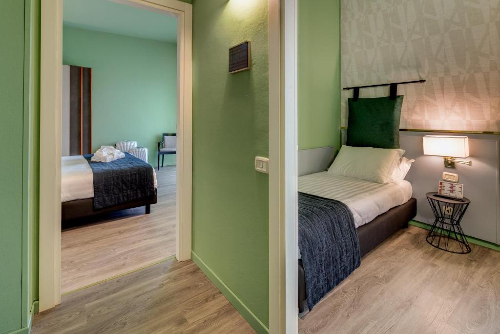 Postel nebo postele na pokoji v ubytování Best Western Plus CHC Florence