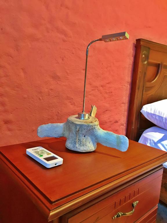 Postel nebo postele na pokoji v ubytování Lonesome George Ecolodge