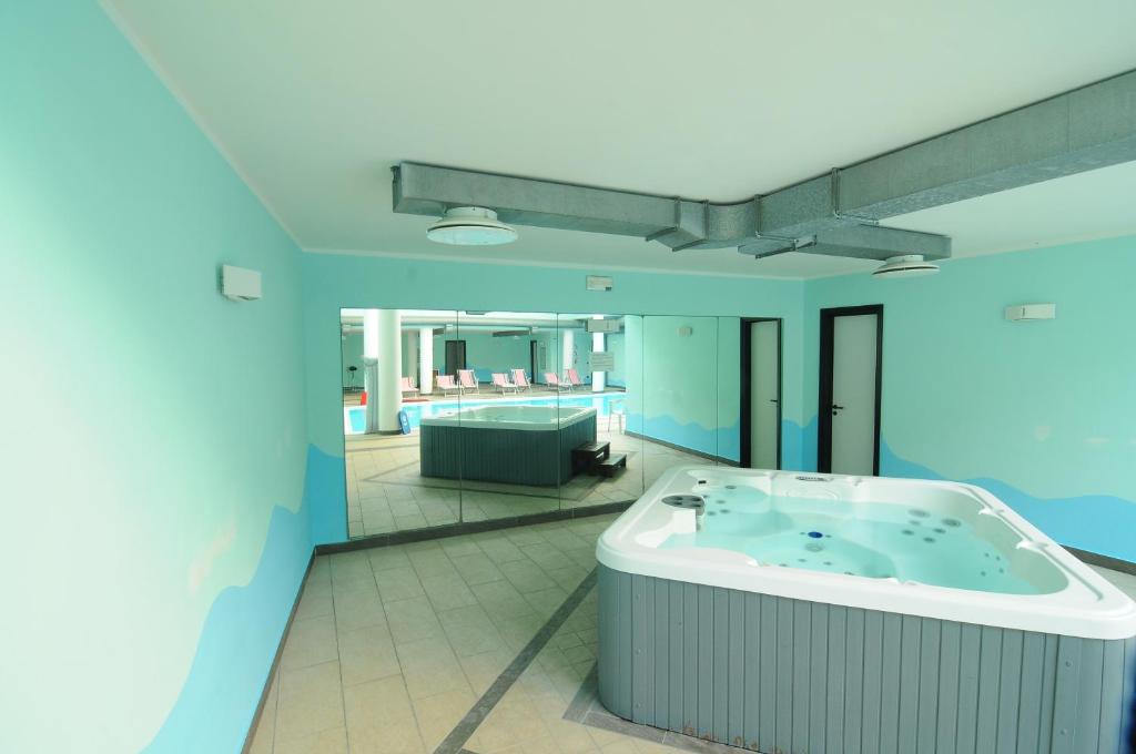 Postel nebo postele na pokoji v ubytování Hotel Residence Mondial