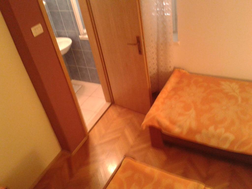 Postel nebo postele na pokoji v ubytování Apartment and rooms Laguna