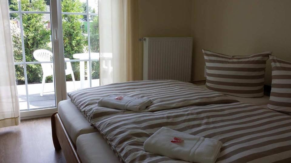 Postel nebo postele na pokoji v ubytování Gästehaus Beckord