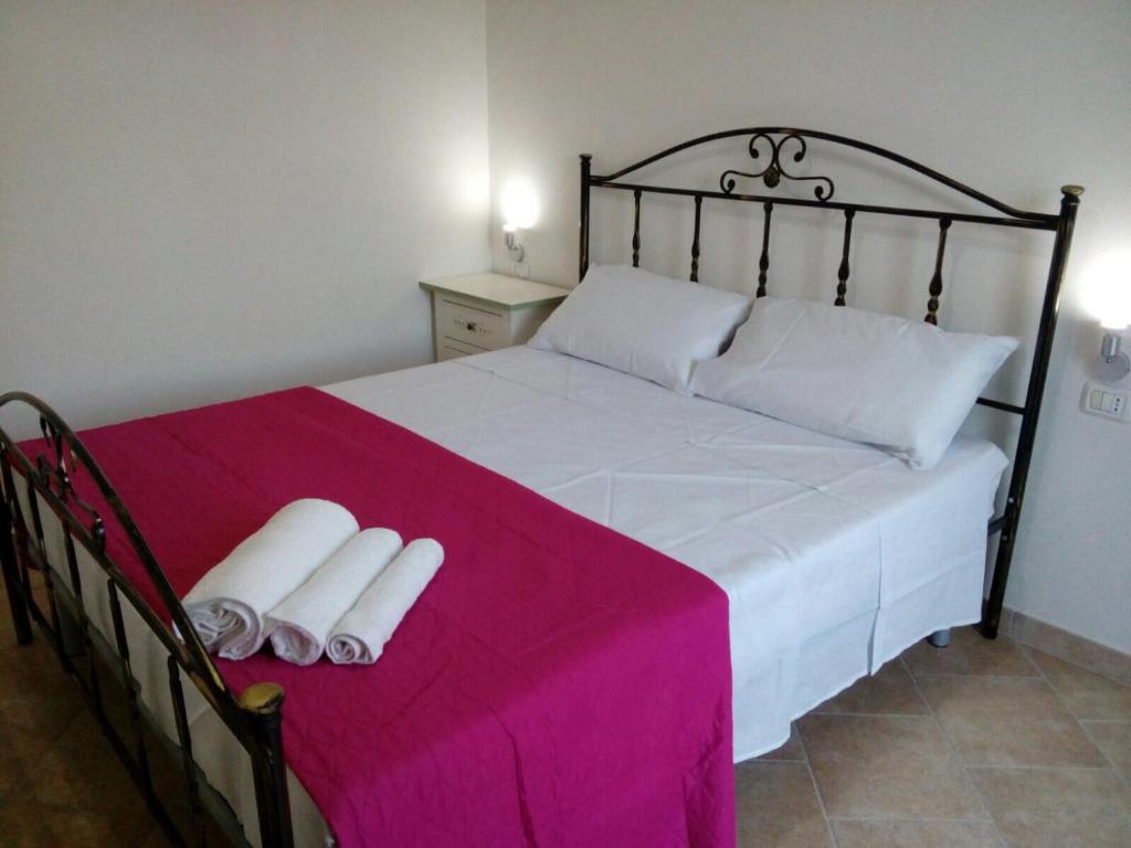 Postel nebo postele na pokoji v ubytování Borgo Degli Ulivi Rooms