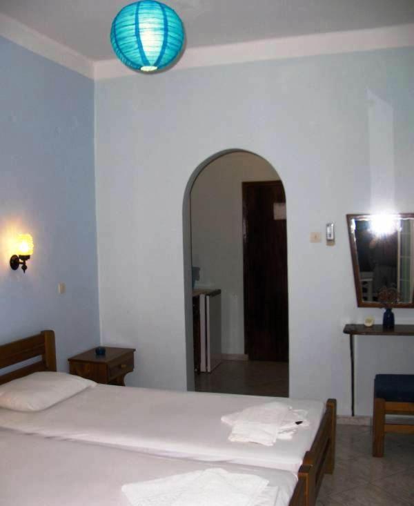 Кровать или кровати в номере Atlantis Hotel