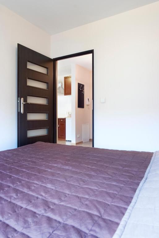 Posteľ alebo postele v izbe v ubytovaní Cracow Stay Apartments