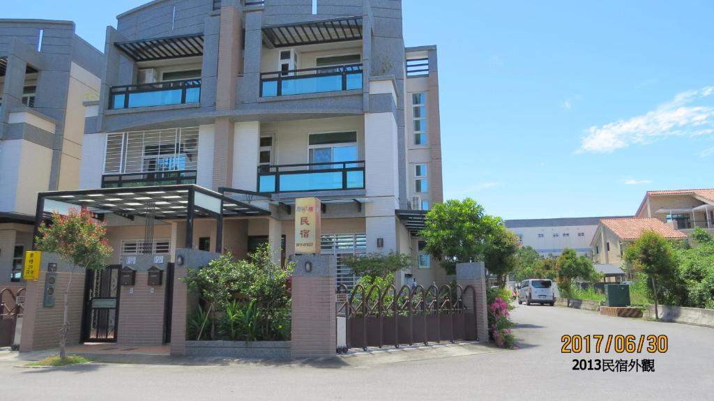 a building with a gate in front of it at 2013 Homestay in Taitung City