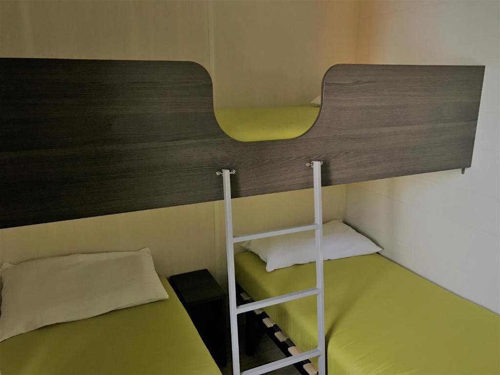 Postel nebo postele na pokoji v ubytování Camping Pirinenc