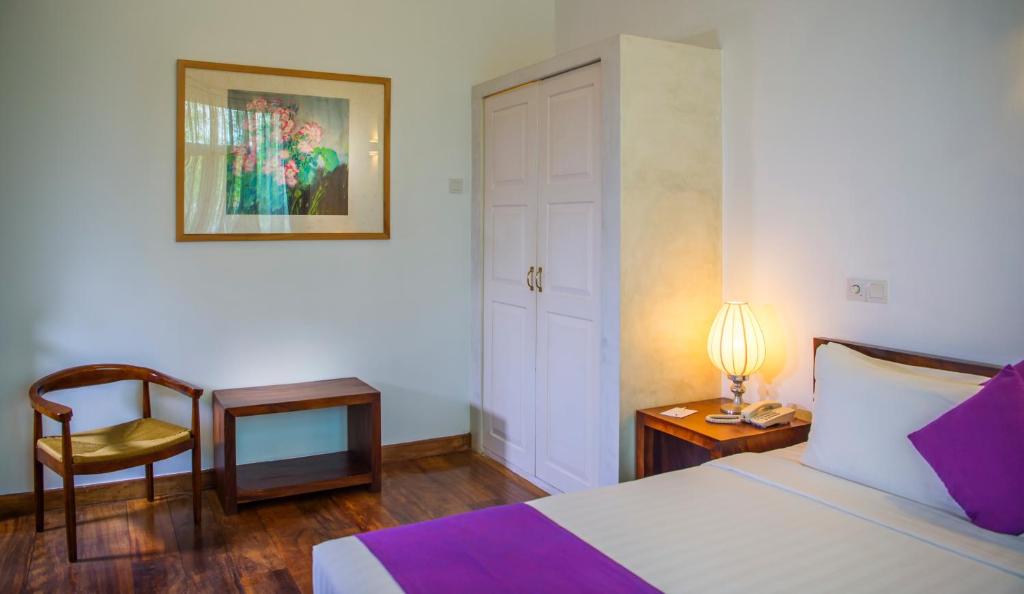 Postel nebo postele na pokoji v ubytování Zylan Colombo