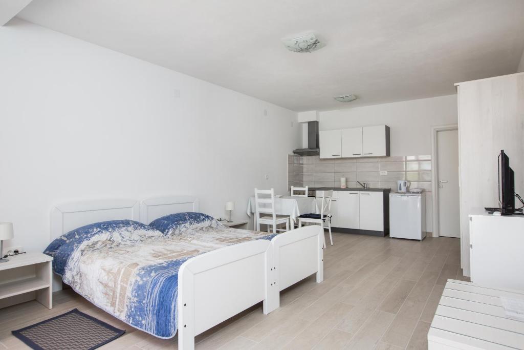 Posteľ alebo postele v izbe v ubytovaní Apartmani Ve-Ro