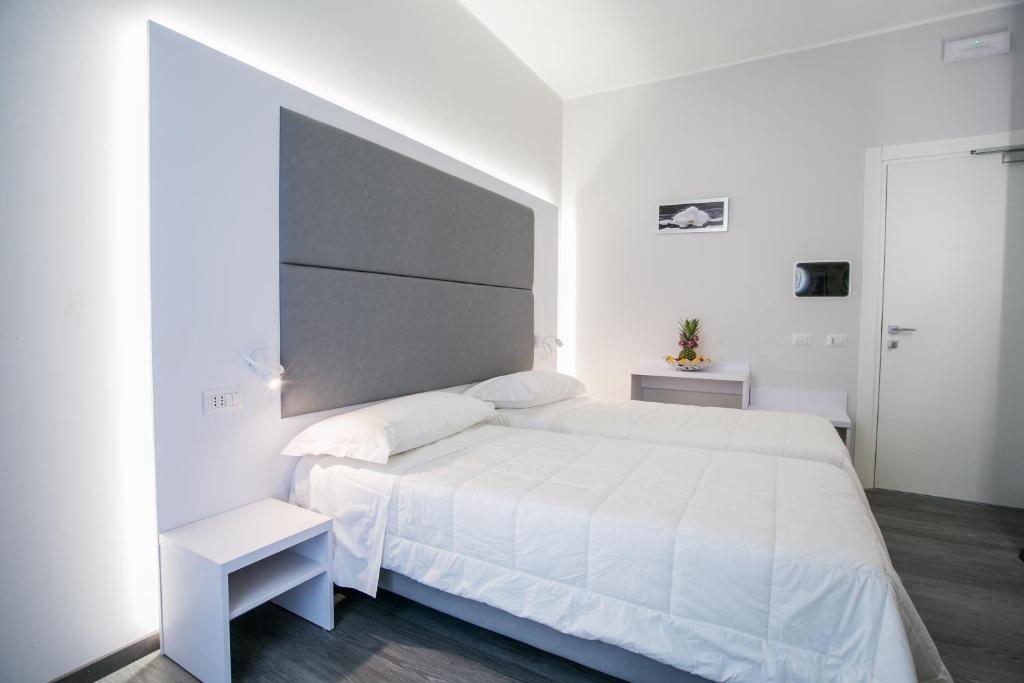 Postel nebo postele na pokoji v ubytování Hotel La Torraccia