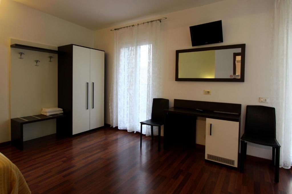TV a/nebo společenská místnost v ubytování Lux Hotel Durante