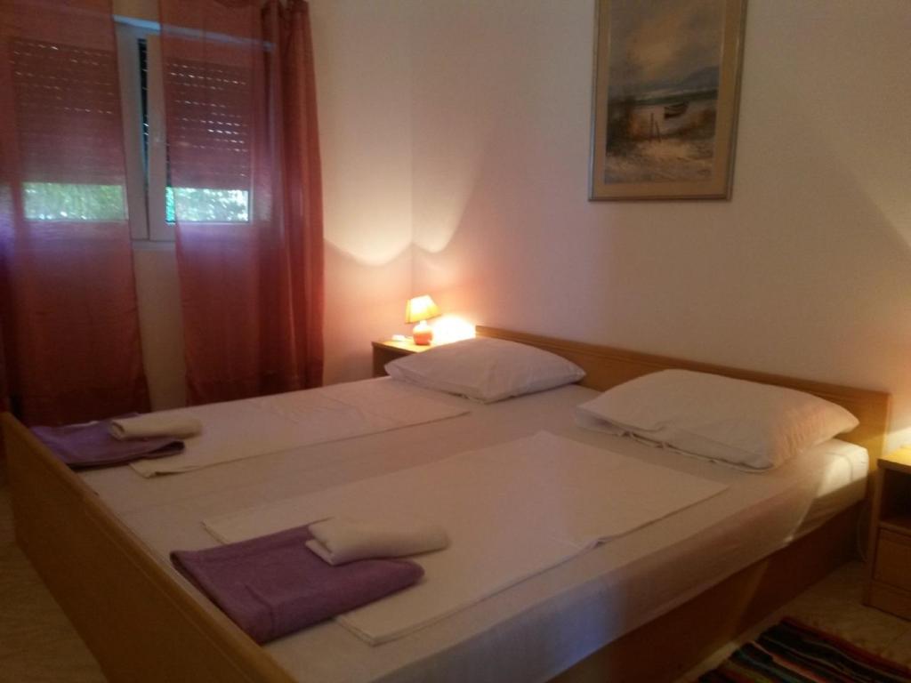 Postel nebo postele na pokoji v ubytování Apartments Verica
