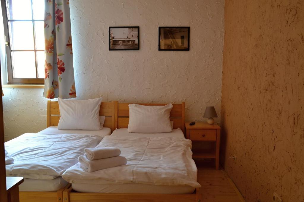 Postel nebo postele na pokoji v ubytování Penzion Mlýn Sedlec