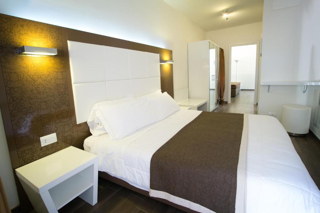 Postel nebo postele na pokoji v ubytování Hotel La Torraccia