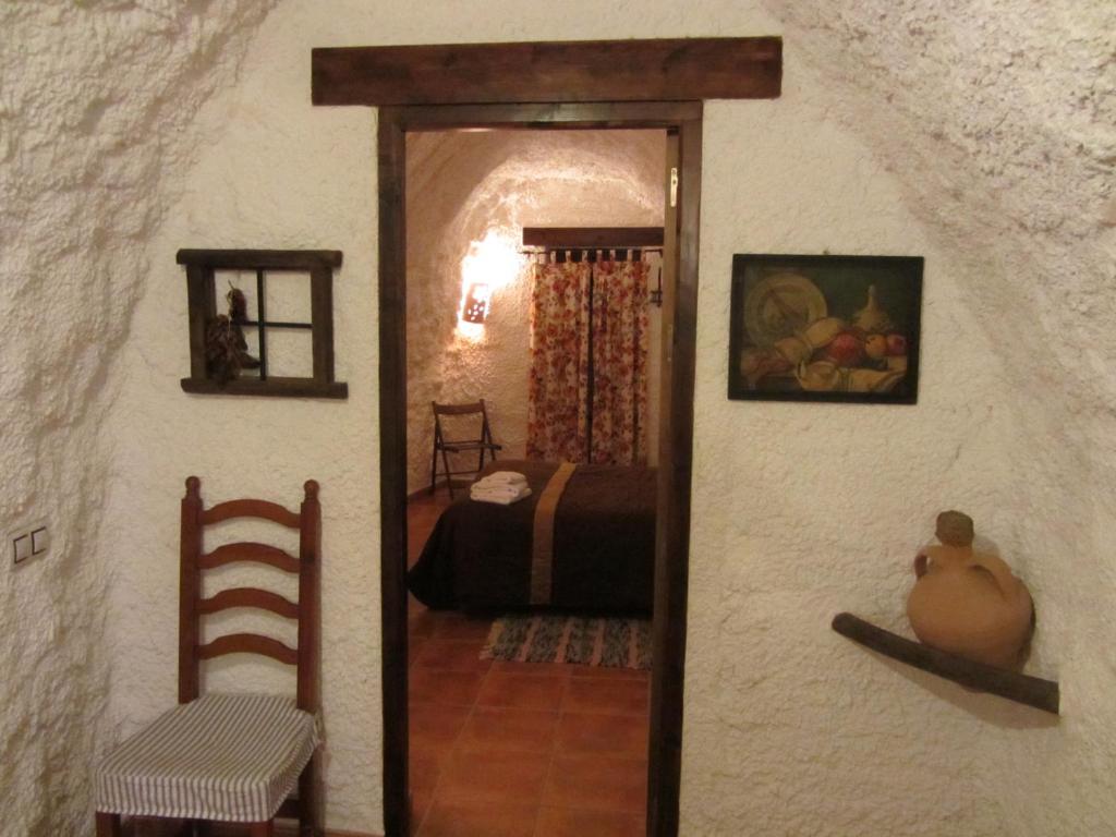 a room with a door leading to a bedroom at Cuevas el Balcón de Orce in Orce