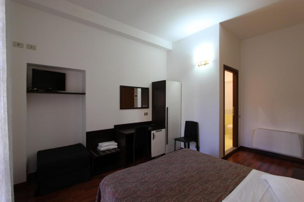 TV a/nebo společenská místnost v ubytování Lux Hotel Durante