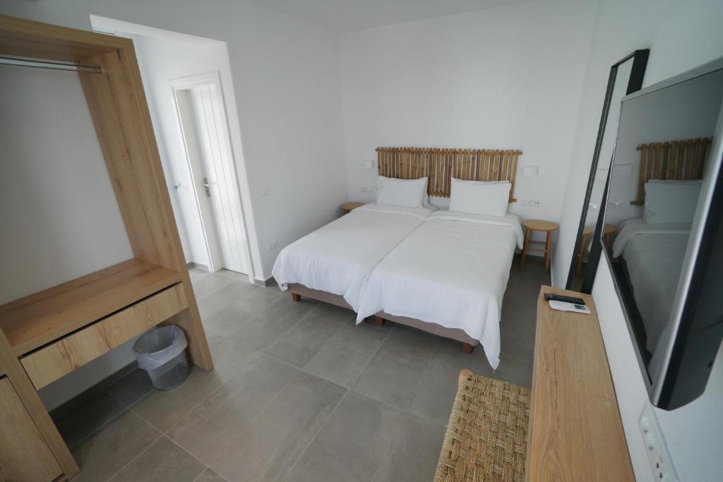 Postel nebo postele na pokoji v ubytování Jason Hotel
