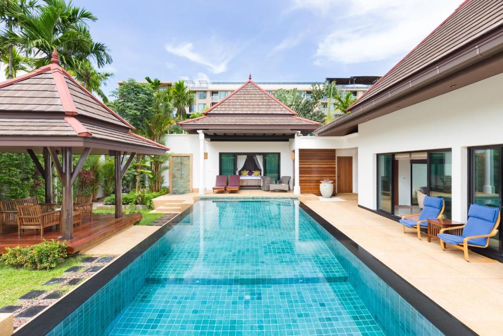 a pool in the backyard of a villa at Baan Thai Surin Garden in Surin Beach