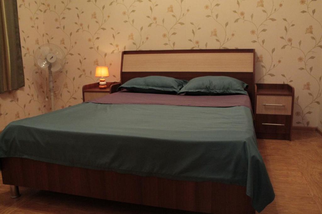 Llit o llits en una habitació de Best Host