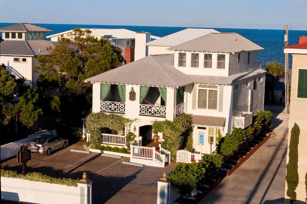 an aerial view of a house with the ocean in the background at DeSoto Beach Bed and Breakfast in Tybee Island