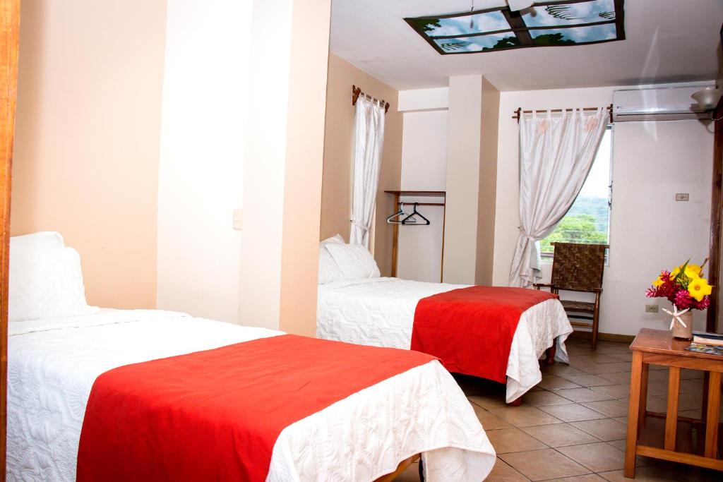 Postel nebo postele na pokoji v ubytování Hotel Maya Vista